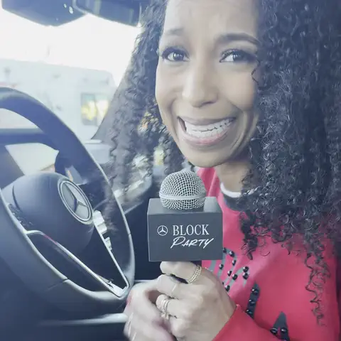 Looping clip: Chelsea with the Mercedes-Benz Block Party mic, talking to camera from the driver's seat