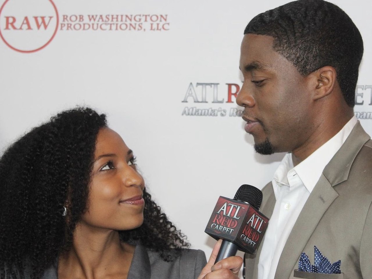 Chelsea interviewing Chadwick Boseman on the red carpet at the Get On Up premiere